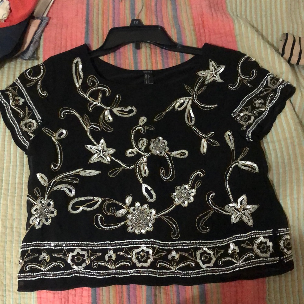 A sheer texture but it has a tank top under